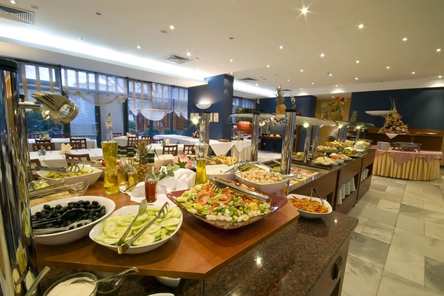 A premium hotel buffet featuring a selection of fresh and cooked dishes included in sports hospitality packages.